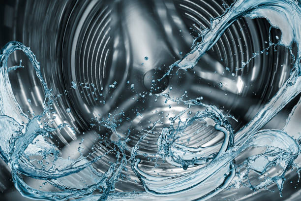 Washing machine drum Washing machine drum with water splash. washing machine drum stock pictures, royalty-free photos & images