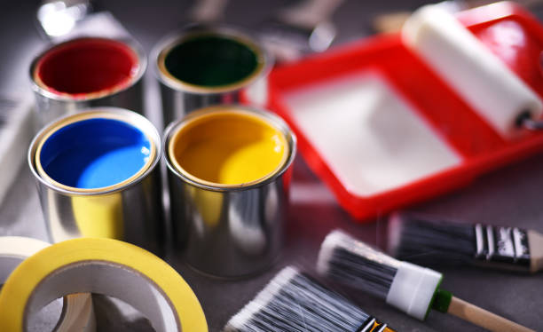 istock Paintbrushes of different size and paint cans 1463361653
