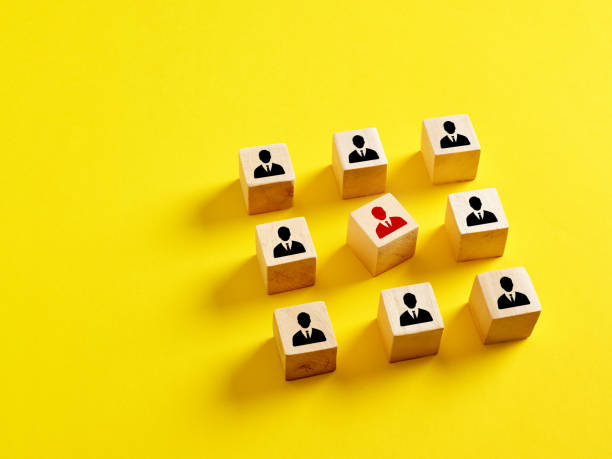 istock Incompetent employee in the team. Unsuitability for work, inappropriate for teamwork. Conflict with colleagues. Wooden cubes with factory icons. 1463365875