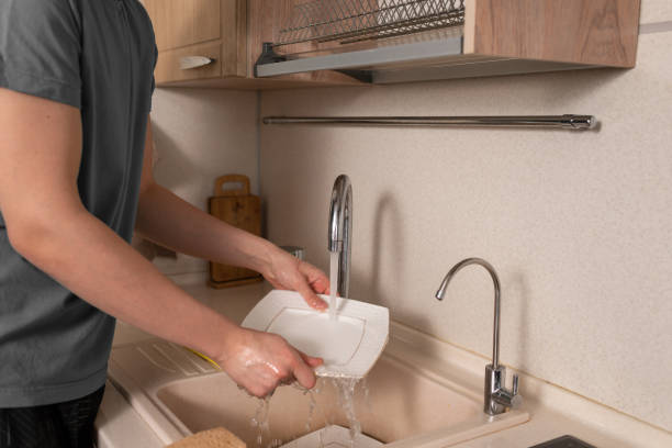 istock Man doing chores. Man washing dishes 1463368308
