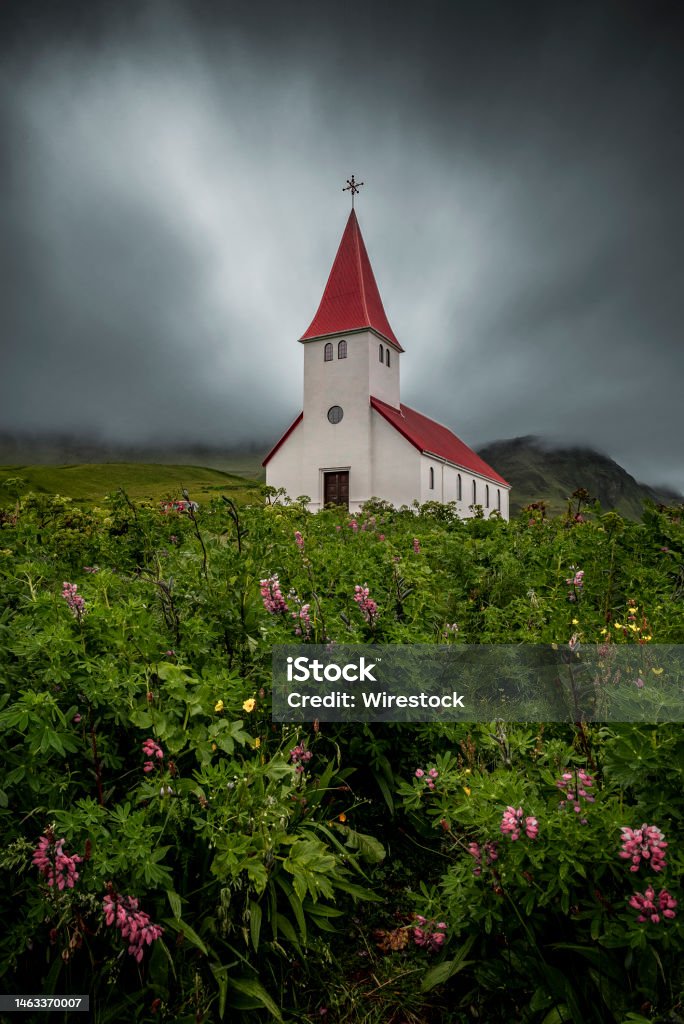 Vertical shot of Reyniskirkja Church. Vik, Iceland. A vertical shot of Reyniskirkja Church. Vik, Iceland. Architecture Stock Photo
