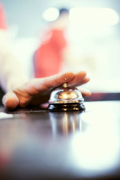 istock Vertical shot of a hand ringing on a call bell 1463370481