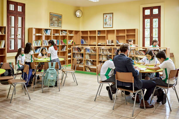 istock Private school children spending time at library 1463374661