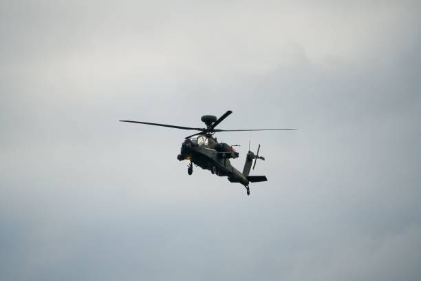 istock Military helicopter landing in flight 1463376365