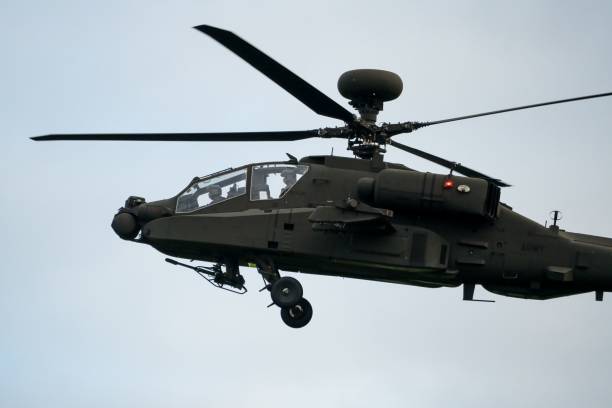 istock Military helicopter landing in flight 1463376373