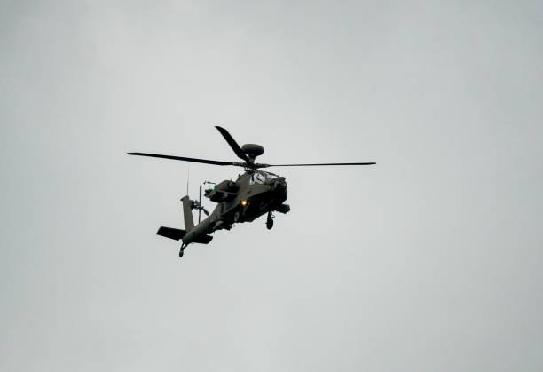 istock Military helicopter landing in flight 1463376379