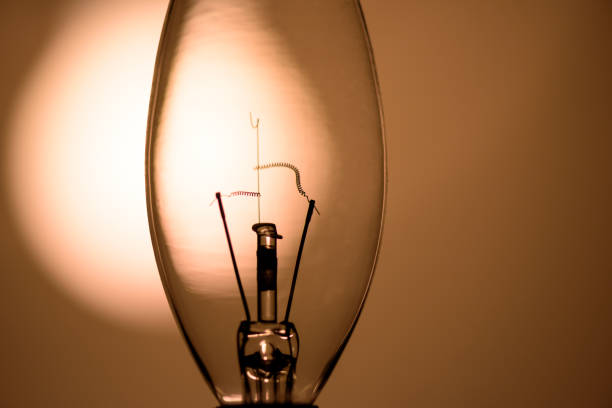 istock Macro shot of a glass Bulb with blurred light in the background 1463376391