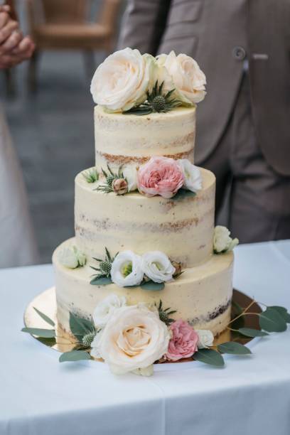 istock Bride and the groom cutting the wedding cake 1463377148