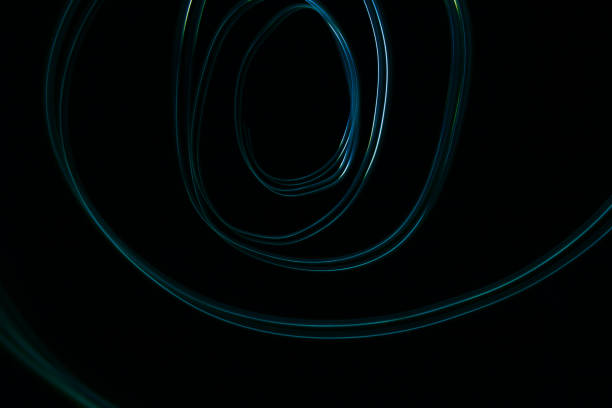 istock Glowing electric lights on black background 1463378283