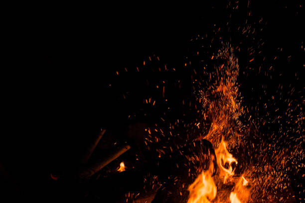 istock Photo of sparks bouncing off from a bonfire at night 1463378337