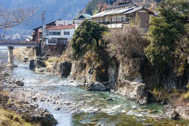 The townscape of Gujo Hachiman from the new bridge (jump bridge) over the Yoshida River in Gujo City, Gifu Prefecture, on a sunny day in March 2022.