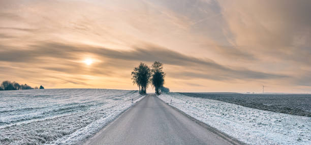 Winter landscape with fence and sun star