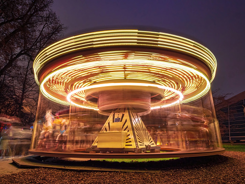 Moving Christmas Market Carrousel with light illumination during night