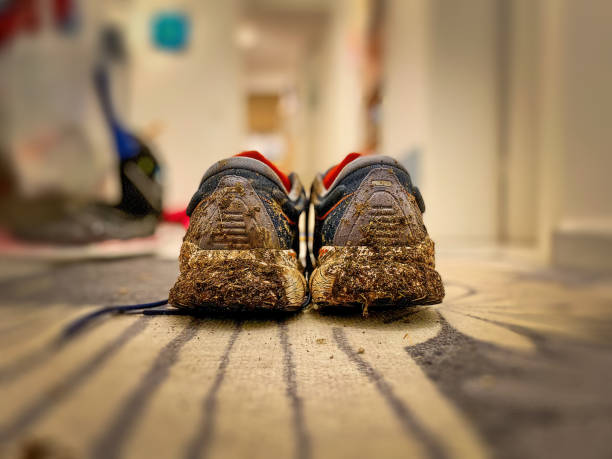 istock Dirty Running Shoes coming home 1463380975