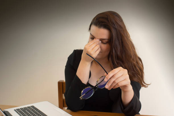 istock Hispanic young businesswoman exhausted from work in her office 1463381877