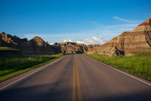 The Badlands Loop Road, SD 240, is a fantastic way to see the North Unit of Badlands National Park. The two-lane paved road is appropriate for all motor vehicles, shown here during a sunset.