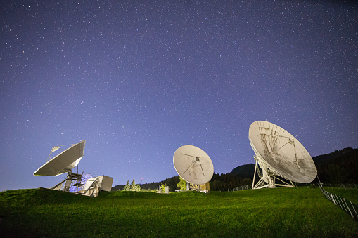 Group of satellite dishes for communication and research at night