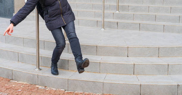 istock Falling Woman on Slippery Stairs, Icy Steps Fell, Unsafe Wet Steps, Slippery Stairs Problem 1463385526