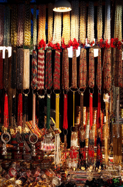 istock selling keychains, necklaces, and religious neckpieces used while praying, at Haridwar Markets. Faith in prayers. 1463386174