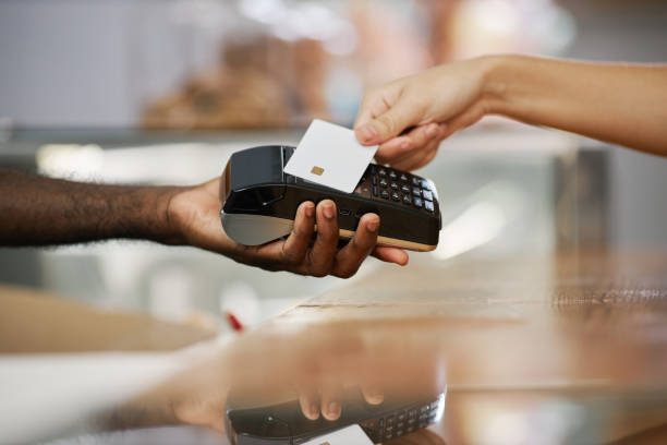 istock Cashier Desk Worker Accepting Payment 1463386460