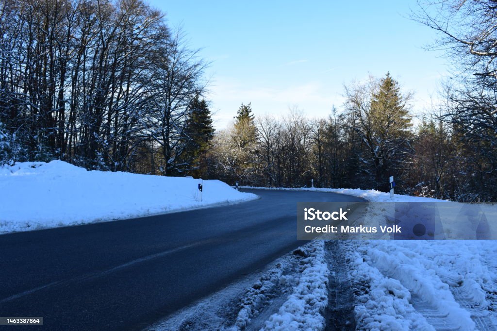 mountain road surrounded by snow Eifel, Hohe Acht, public road around the Nordschleife Adventure Stock Photo