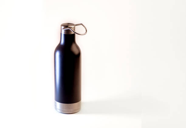 istock Bottle for water black matte on white background isolated 1463391321