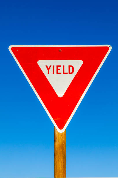 istock yield Sign at the highway with blue sky 1463391557