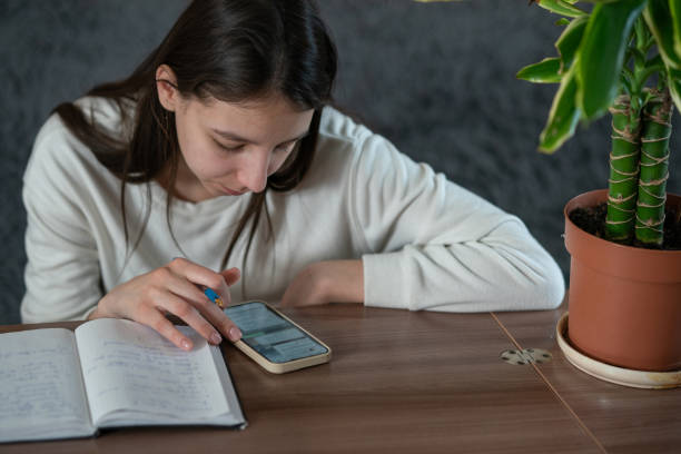 istock freelancer working at home sitting with a notebook and phone at the table 1463392833