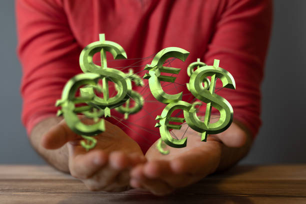 istock 3D rendered currencies held in a person's hand 1463393289