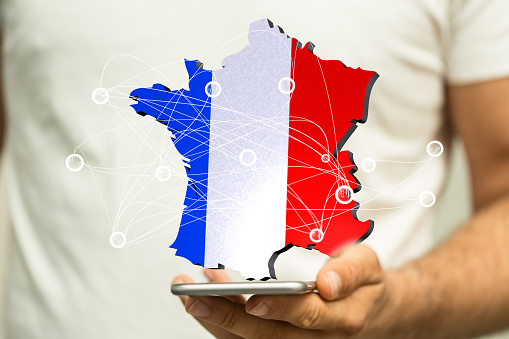A 3D render of the country of France with the flag and a network of lines