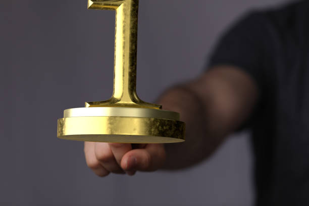 istock Person presenting a first-place award 1463394943