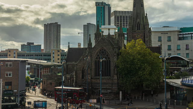 Time lapse of Birmingham St Martin church beside Bull Ring Shopping Centre with crowd people tourist walking in the city of Birmingham
