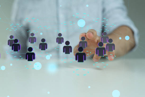 istock Male's hand pointing to an illustration ofNetwork connections team working and interacting 1463395268
