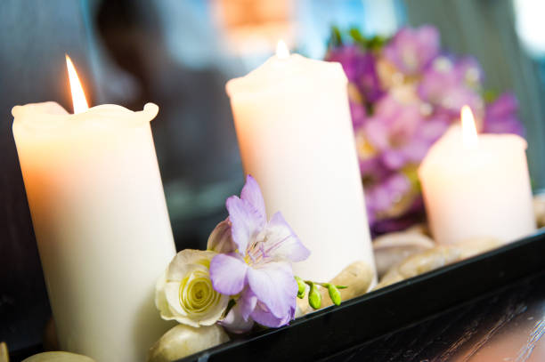 istock Selective focus shot of lightened candles and flowers 1463395994