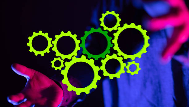 istock Person presenting a 3D rendering digital green gears for business success 1463396087