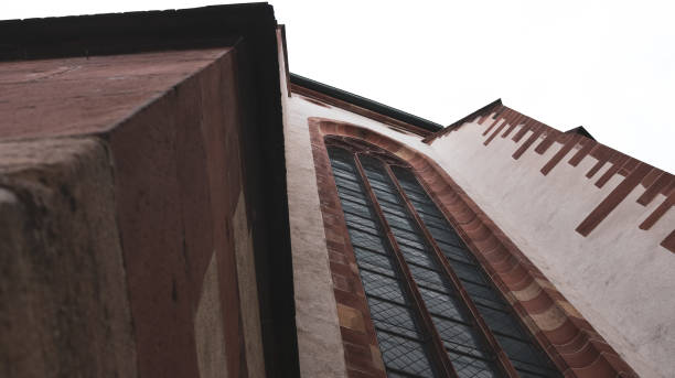 istock Low angle shot of an old building under a cloudy sky 1463396848
