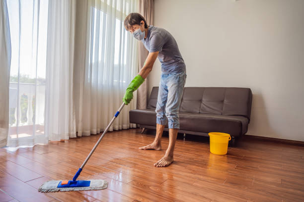 istock Young man with mop cleaning floor at home during coronavirus COVID 19 1463397906