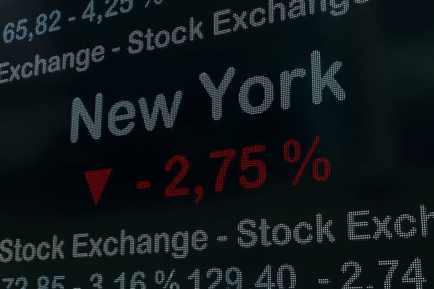 New York stock exchange moving down. USA, New York negative stock market data on a trading screen. Red percentage sign and ticker information. Stock exchange and business concept. 3D illustration trader wall street stock market analyzing stock pictures, royalty-free photos & images