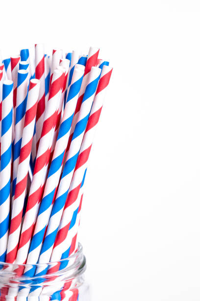istock Multi-colored paper straws for drinks close-up on a white background. 1463400441