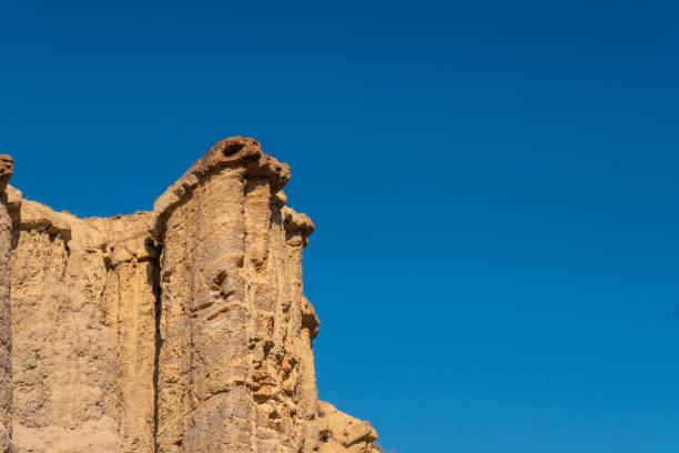 istock Sandstone against the cloudless sky with copy space in the Tabernas desert, Almeria, Spain 1463400724