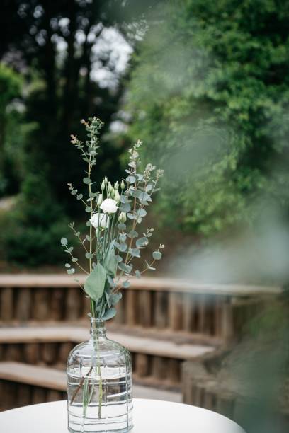 istock Selective focus of a decorated table with flowers in a vase ready for a wedding celebration 1463400837