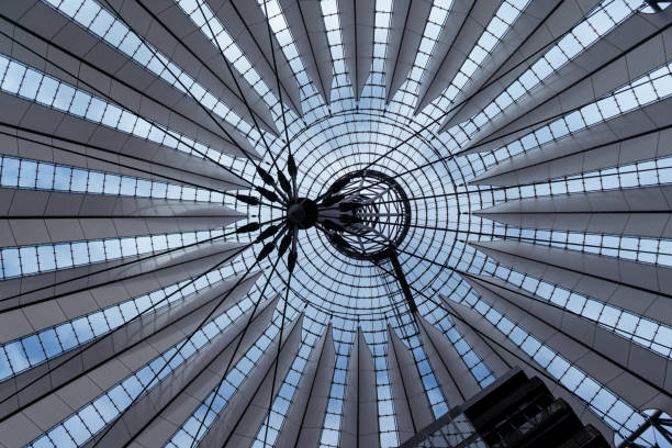 istock Low angle shot of modern glass architecture under blue sky 1463401546