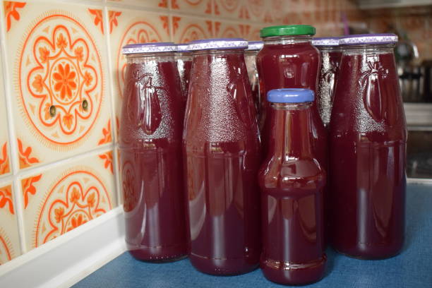 istock red grape juice in reused bottles 1463401612