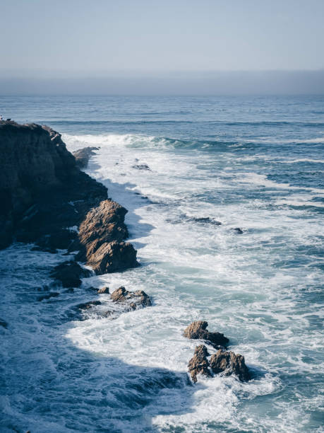 istock Natural view of strong waves hitting a rocky coast 1463403552