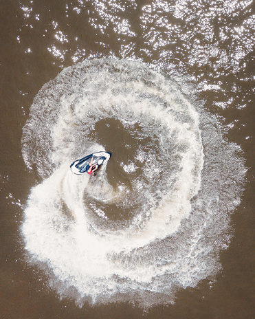 A bird's eye view of a sportsman on a jet ski riding in the whirlpool