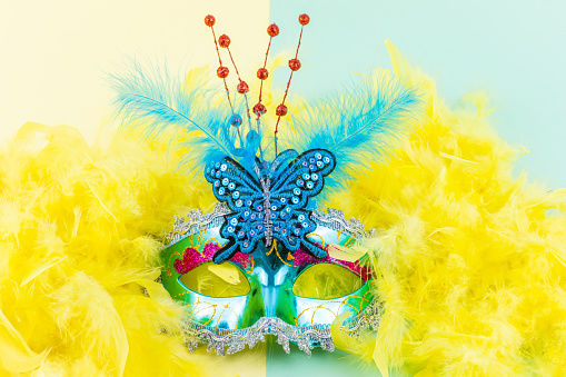 Colorful blue costume accessory with feathers for party and Venice carnival. Horizontal banner with copy space.