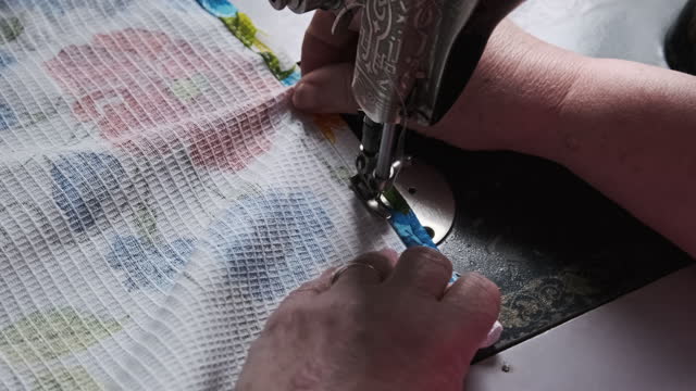 Old Female Hands of Seamstress Sew at Retro Sewing Machine at Home Slow Motion