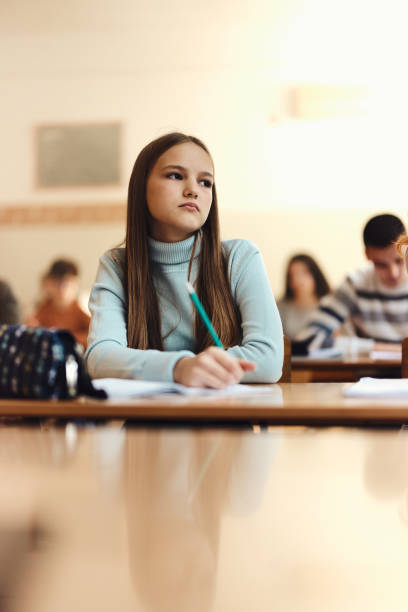 istock Pensive female student having a class at high school. 1463406834