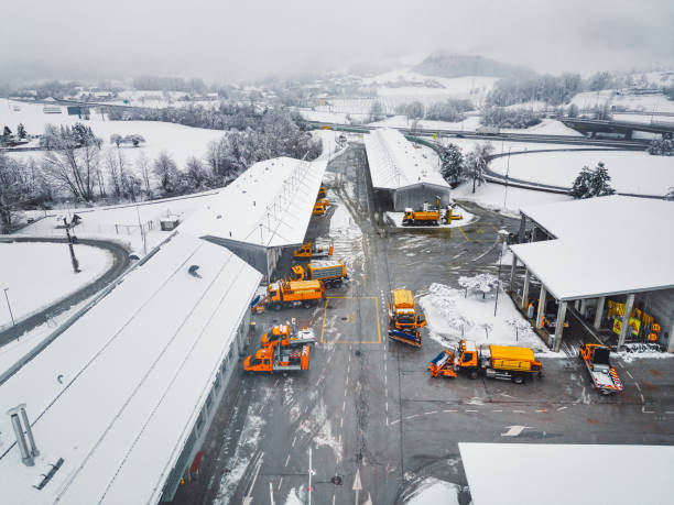 istock Workers on the highway maintenance base having a busy day, with snow causing delays on the road 1463407161