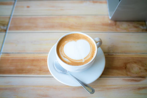 Image of cup of fresh coffee cortado on table, no people